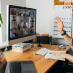 man-working-from-home-attending-a-virtual-meeting-with-staff-members
