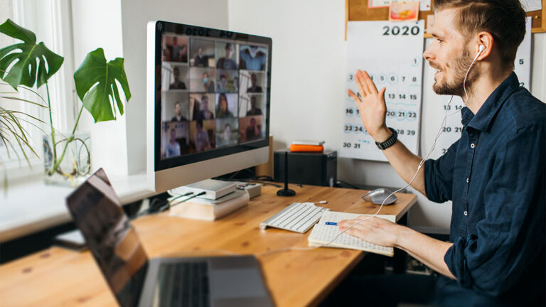 man-working-from-home-attending-a-virtual-meeting-with-staff-members
