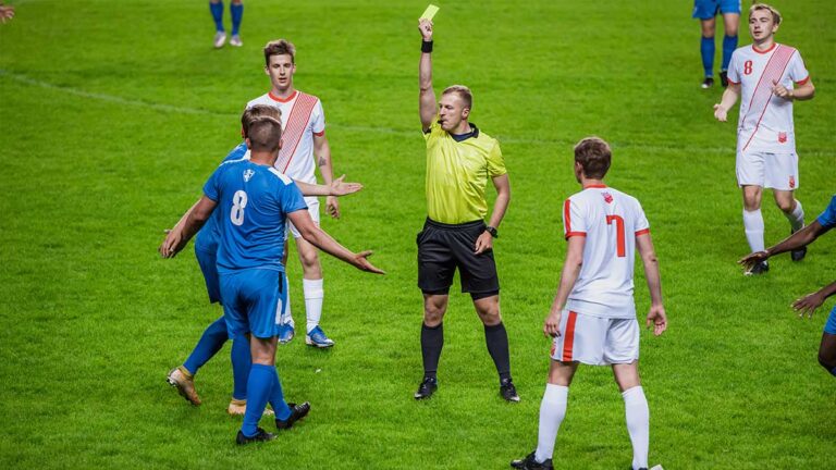 referee-calling-yellow-card-at-international-soccer-football-tournament