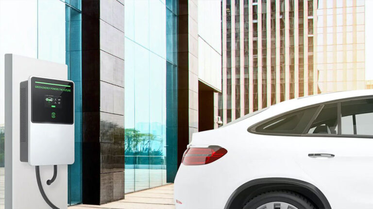 white-electric-vehicle-charging-at-a-commercial-charging-station