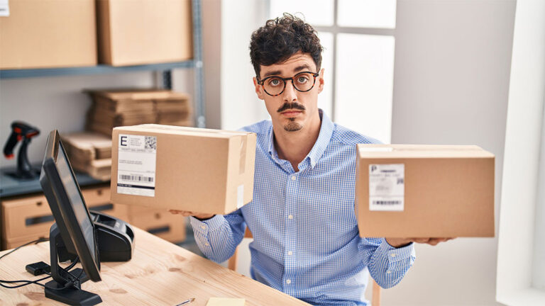 man-holding-two-packages-each-in-one-hand